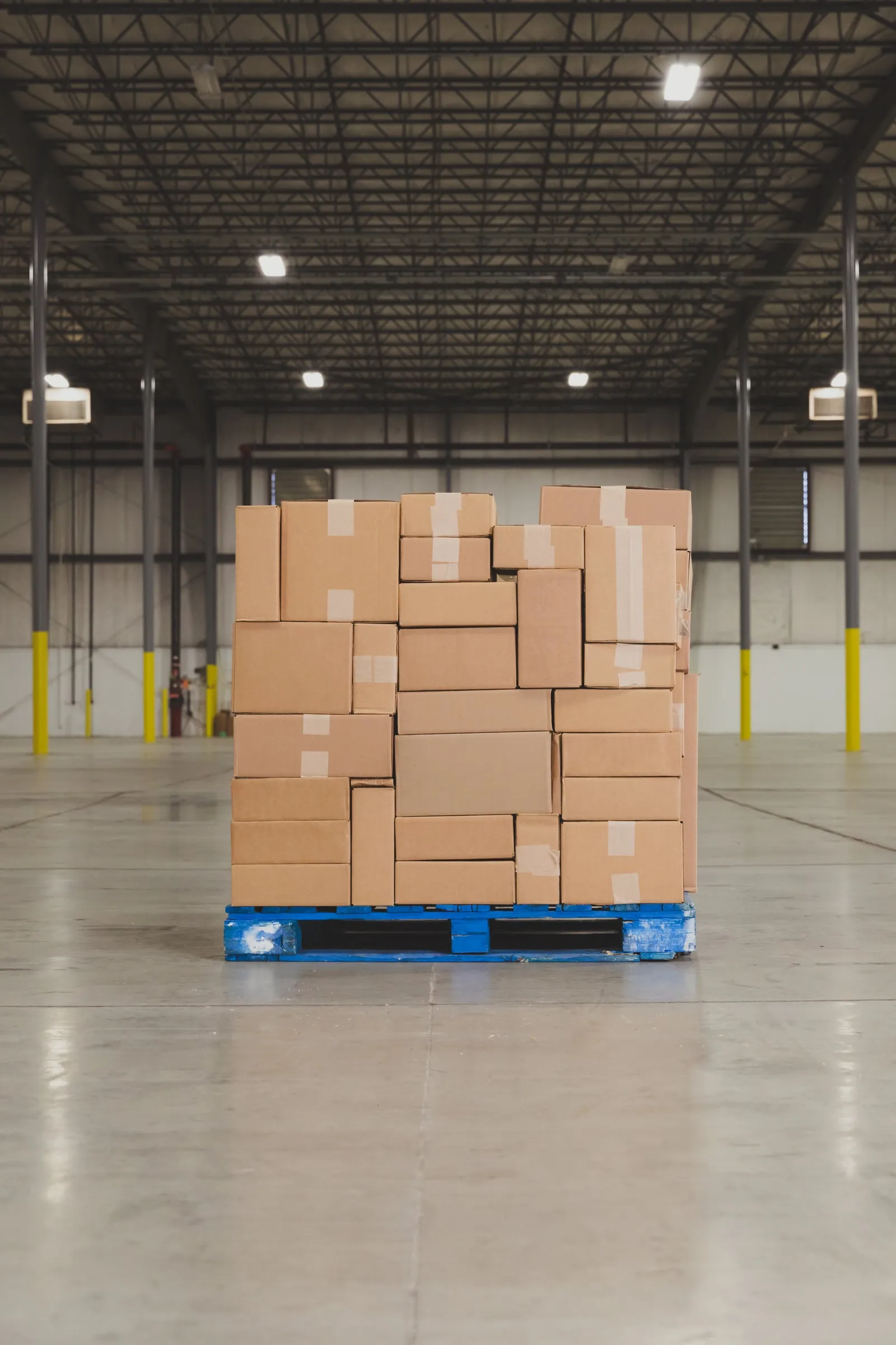 Stocked pallets on warehouse shelving